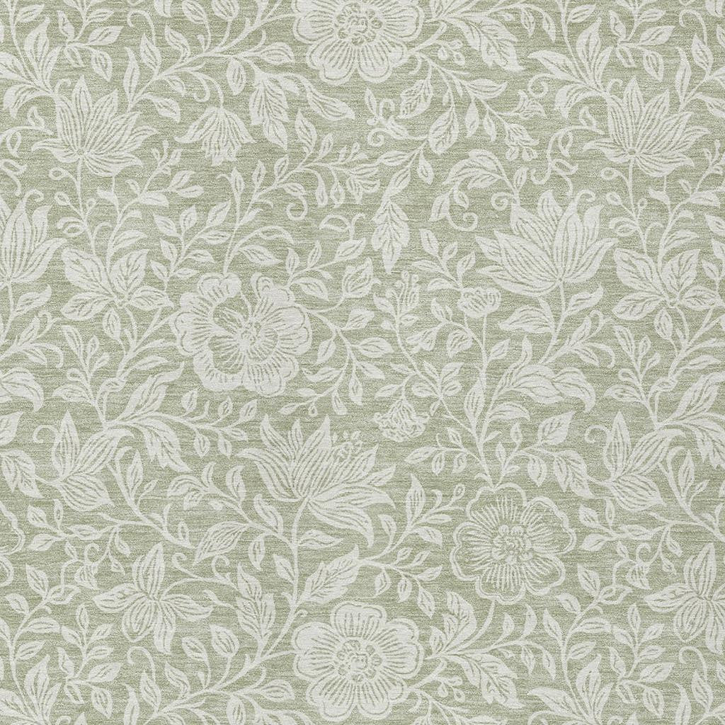 Green and ivory floral rug pattern with leaves and flower outlines, textured look