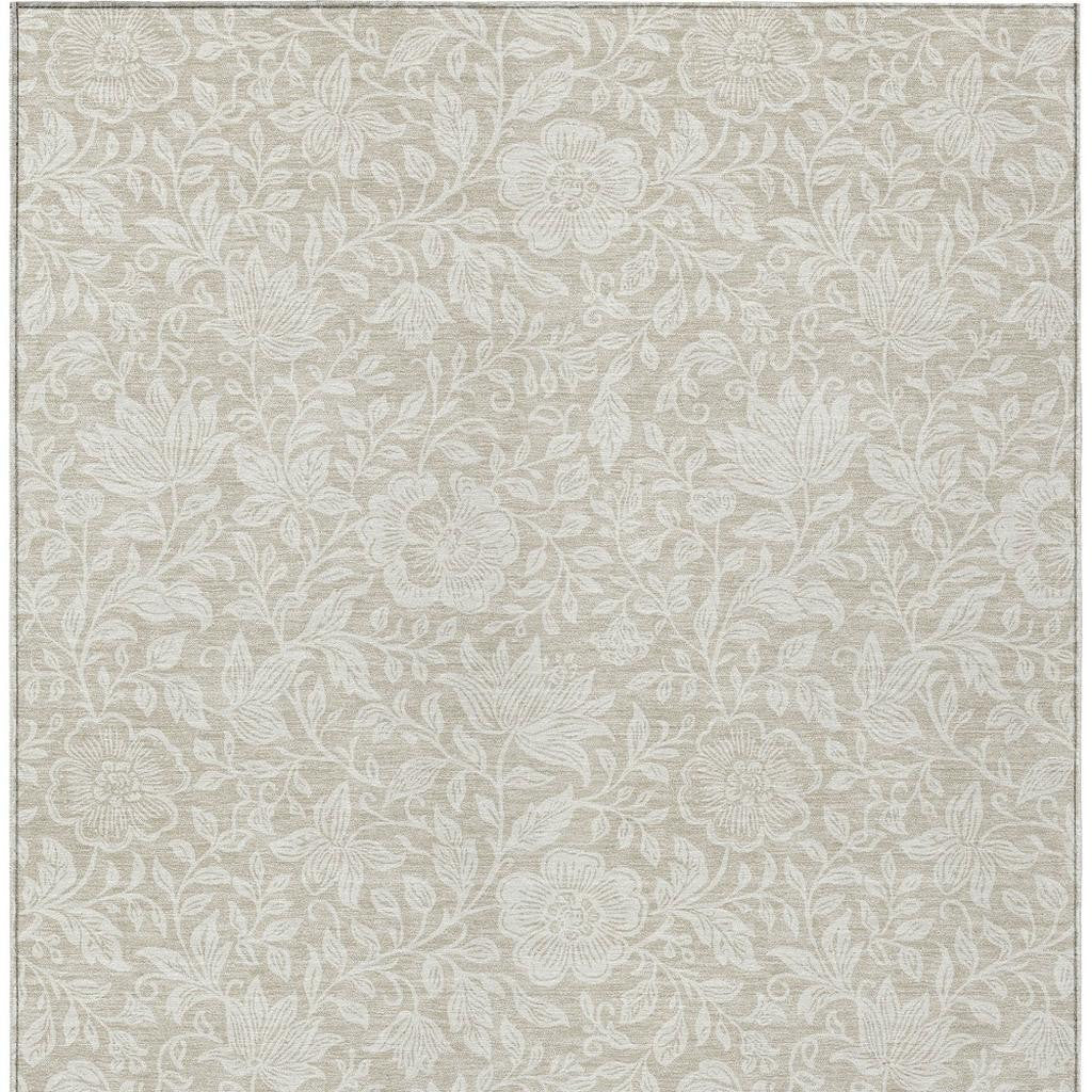 Beige and ivory floral area rug with subtle leaf and flower pattern