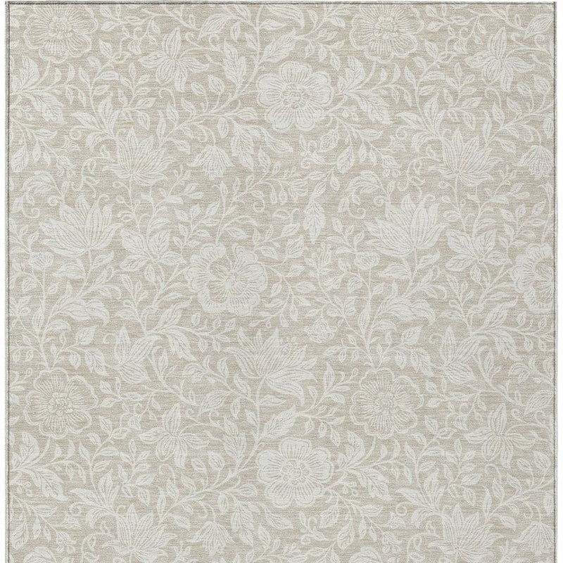 Beige and ivory floral washable indoor/outdoor area rug flat lay with border