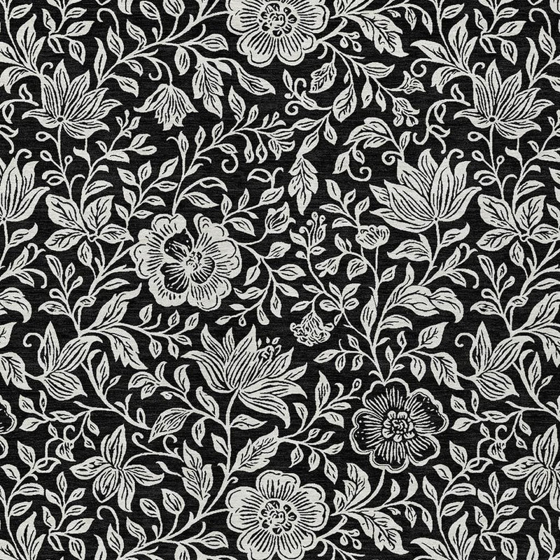Black and ivory floral area rug with bold leaf and flower motifs in line pattern
