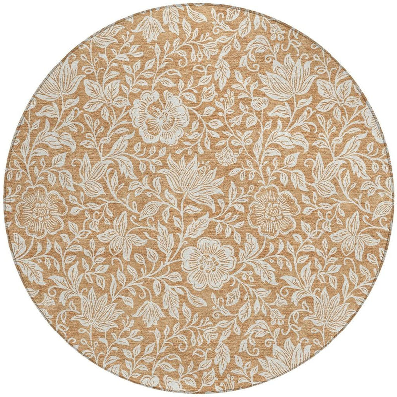 Round area rug with copper-brown and ivory floral medallion pattern, washable