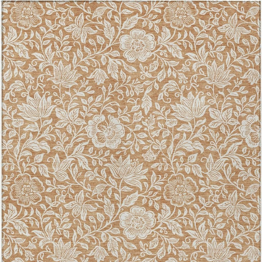 Copper and ivory floral area rug close-up with vine and flower pattern