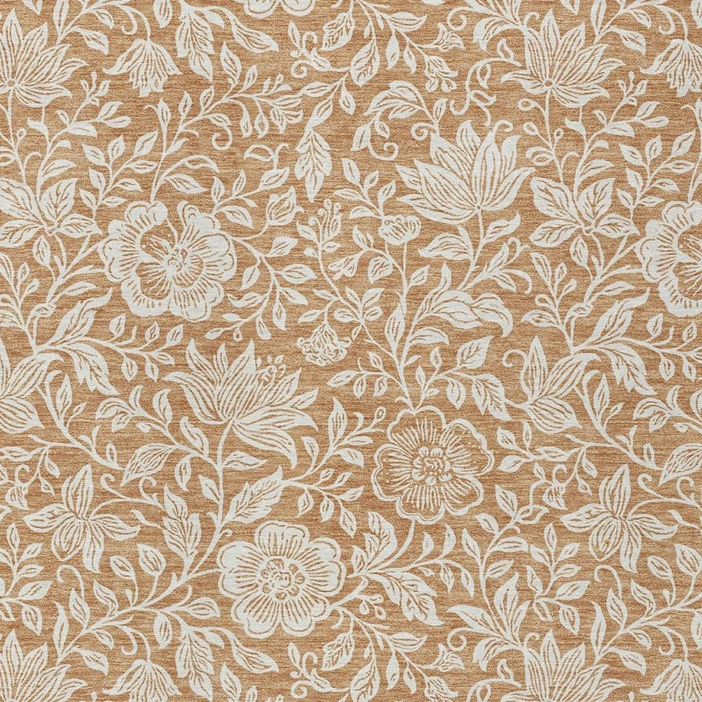 Copper and ivory floral area rug texture close-up with repeating blossoms