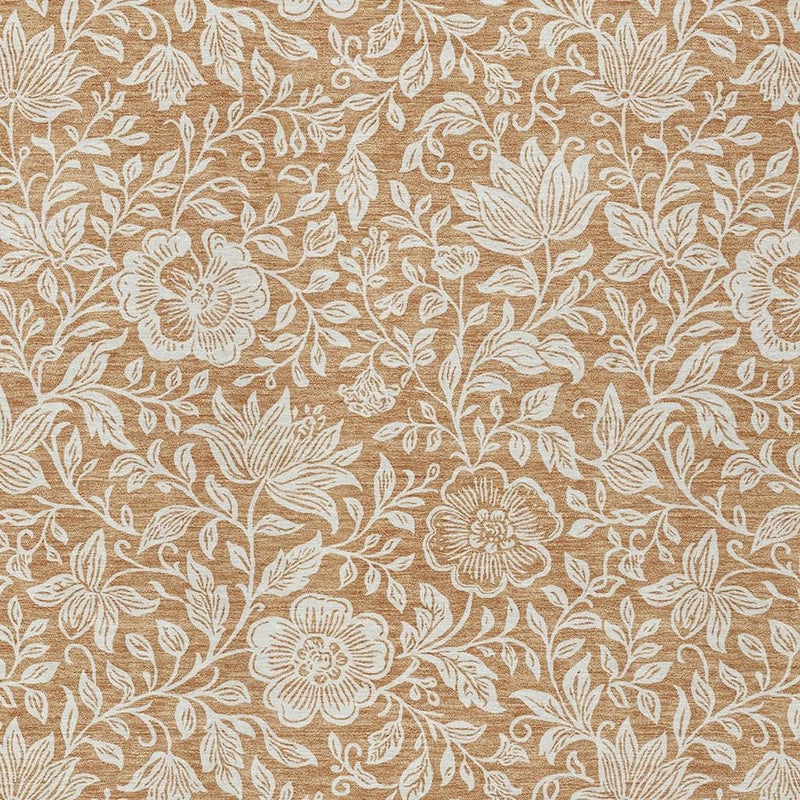 Copper and ivory floral area rug texture close-up with repeating blossoms