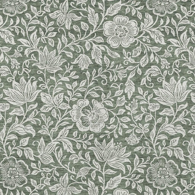 Green rug close-up: ivory blossoms and leafy vines in repeating botanical design.