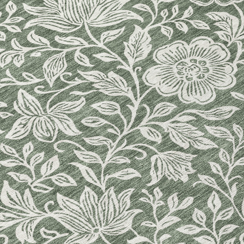 Green area rug with ivory botanical floral vine pattern, textured wash effect.