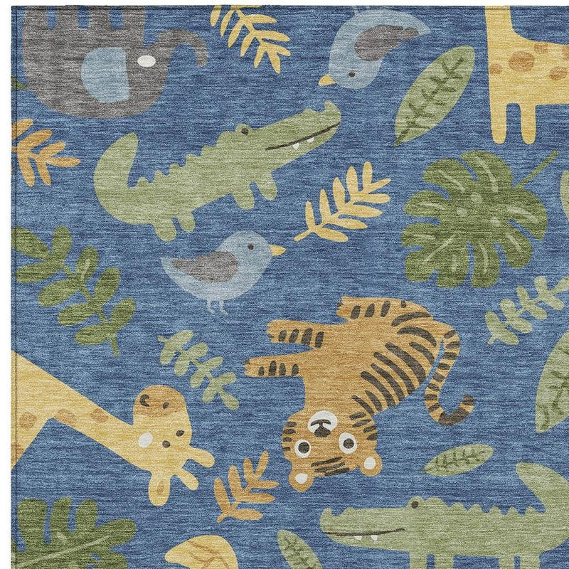 Abstract area rug close-up of blue fabric with beige, green, and gray animal silhouettes.