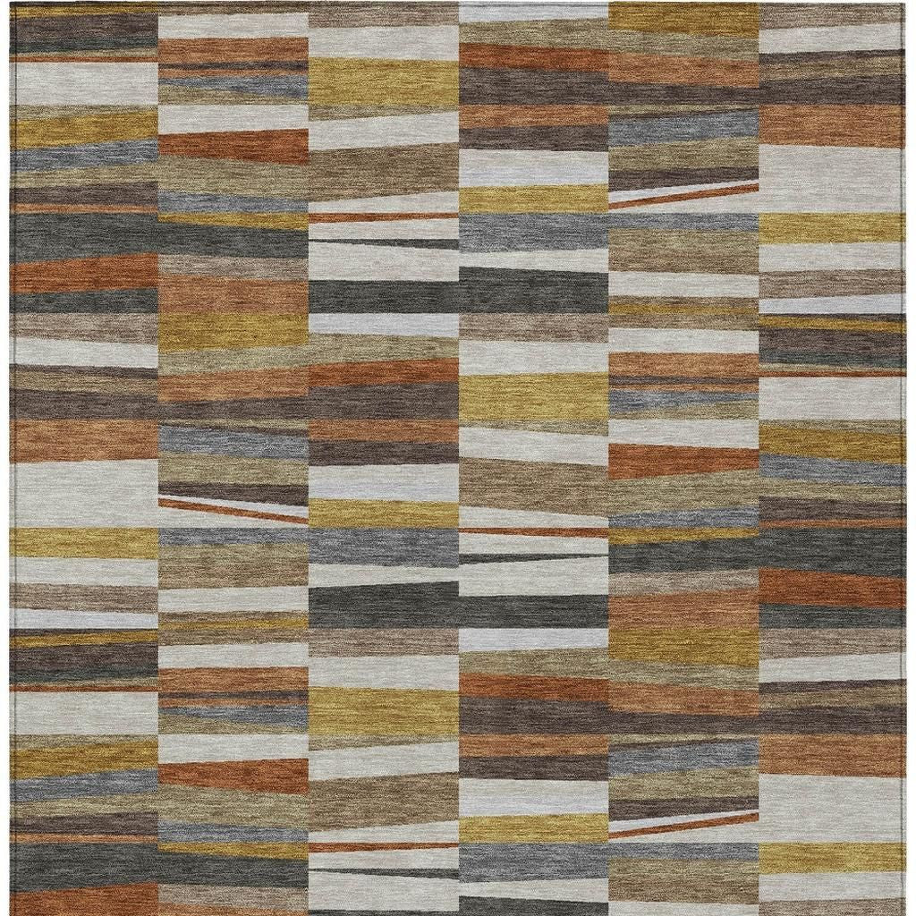 Area rug top view with a grid of multicolor stripe patches in ivory, brown, and blue-gray