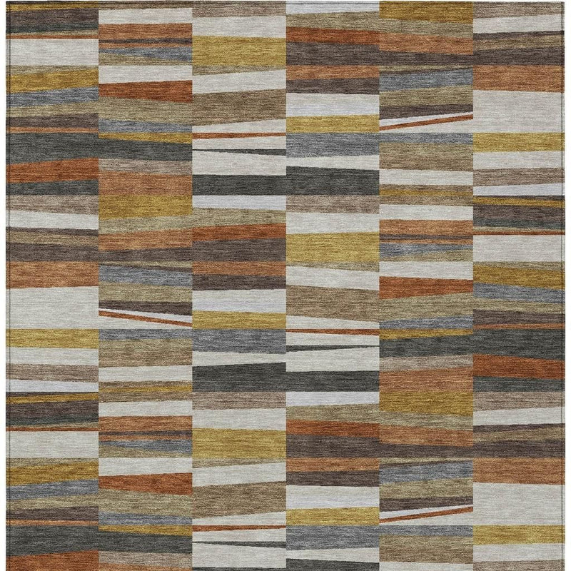 Area rug top view with a grid of multicolor stripe patches in ivory, brown, and blue-gray