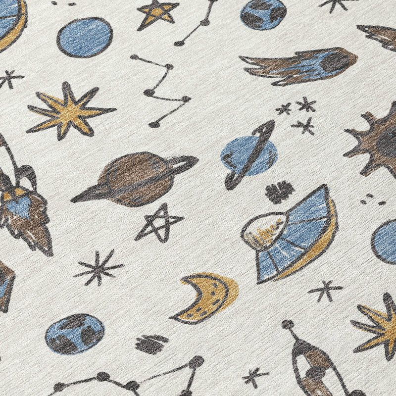 Close-up of ivory animal-print rug pattern, blue planets, moons, stars, and insects