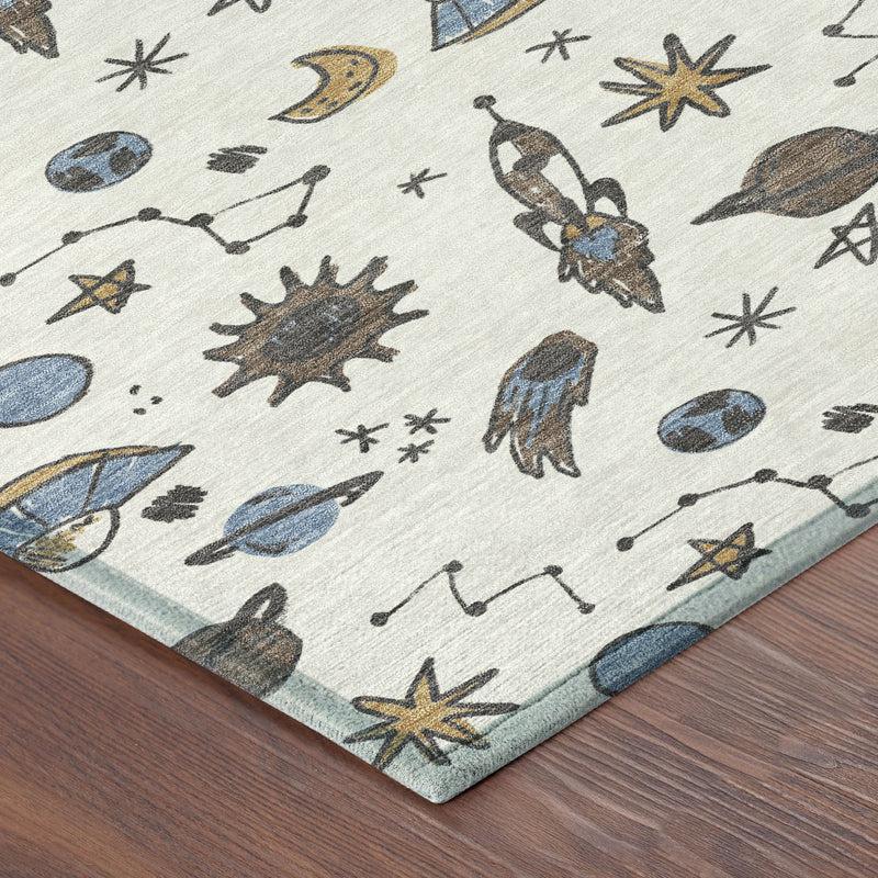 Ivory animal-print area rug corner, blue and gold space motif with planets and insects