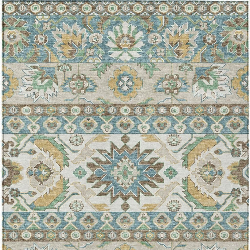 Ivory and teal area rug with repeating star, floral and rosette motifs along border