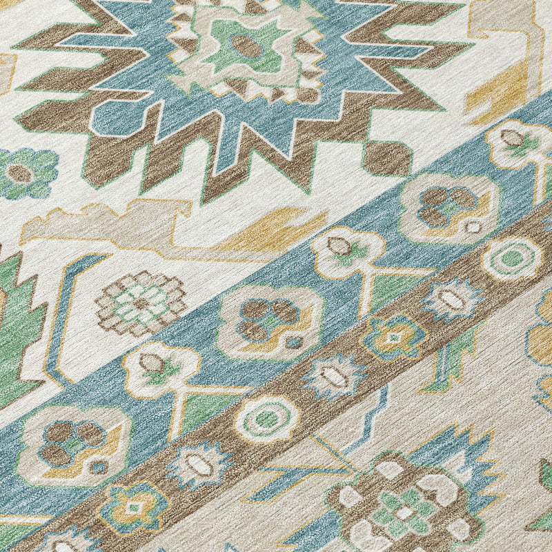 Ivory area rug with teal, green and yellow geometric flowers and zigzag lines