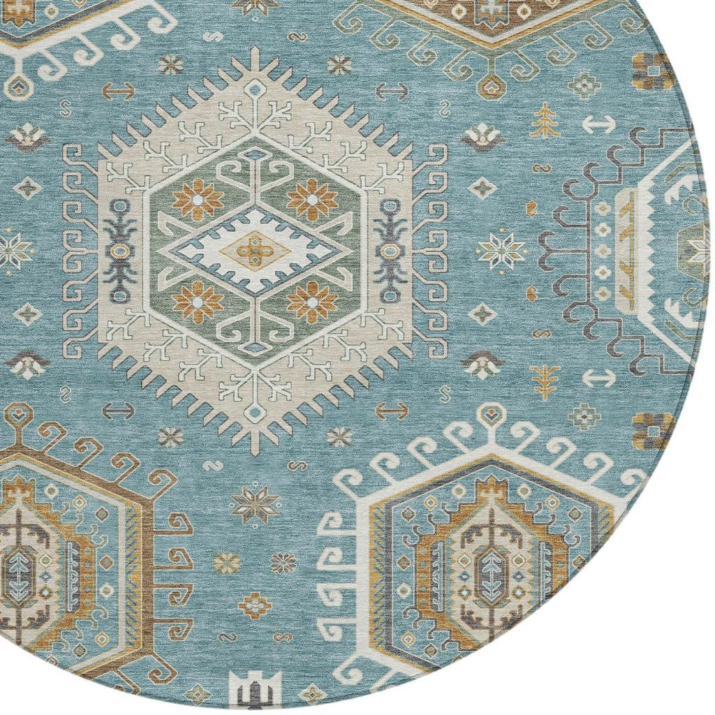 Round area rug with teal blue field and ivory tribal geometric medallion pattern