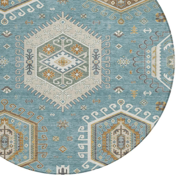 Round area rug with teal blue field and ivory tribal geometric medallion pattern