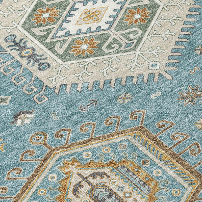 Round rug close-up with teal blue background and multicolor tribal geometric motifs