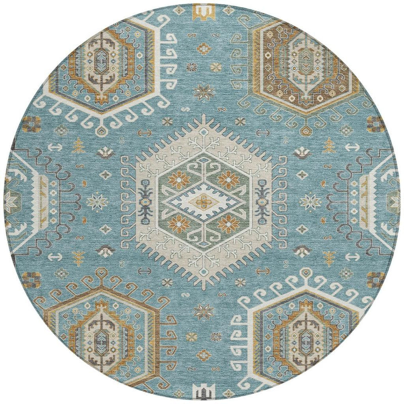 Round area rug featuring teal blue, ivory, and multicolor tribal geometric panels