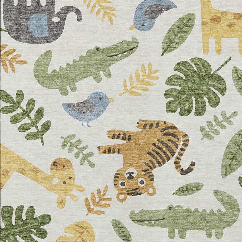 Ivory abstract area rug close-up with green, gray, beige, and blue animal icons