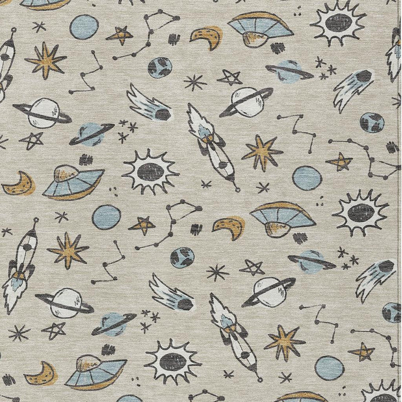 Beige area rug with gray and blue space animal print pattern, close-up view of design.