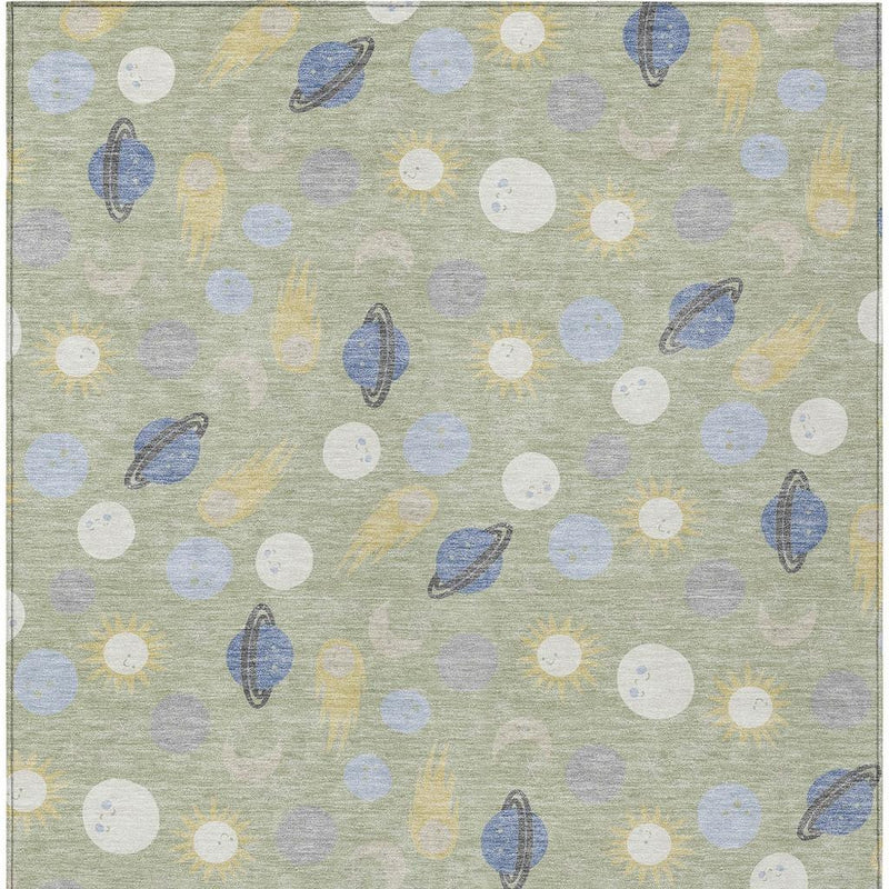 Light green area rug with scattered white, gray, blue and yellow dot-and-leaf motifs