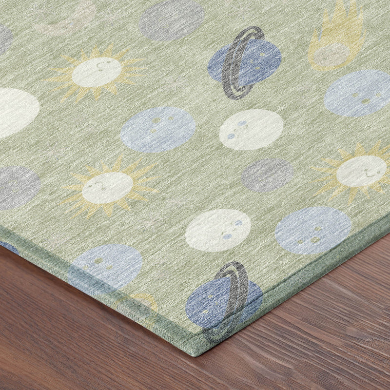 Green corner of area rug with white and blue dot-and-leaf geometric pattern
