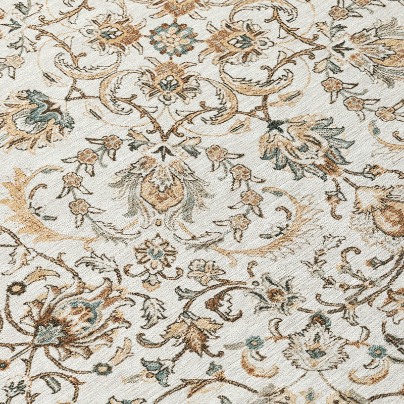 Close-up of ivory rug with detailed floral and vine motif in brown and teal