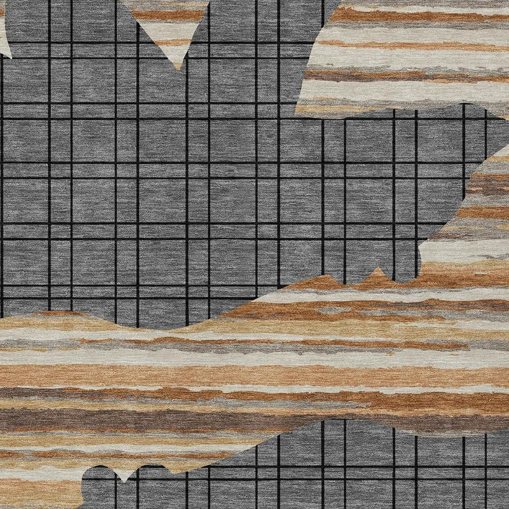Abstract area rug with gray grid and tan, brown, and cream horizontal stripes