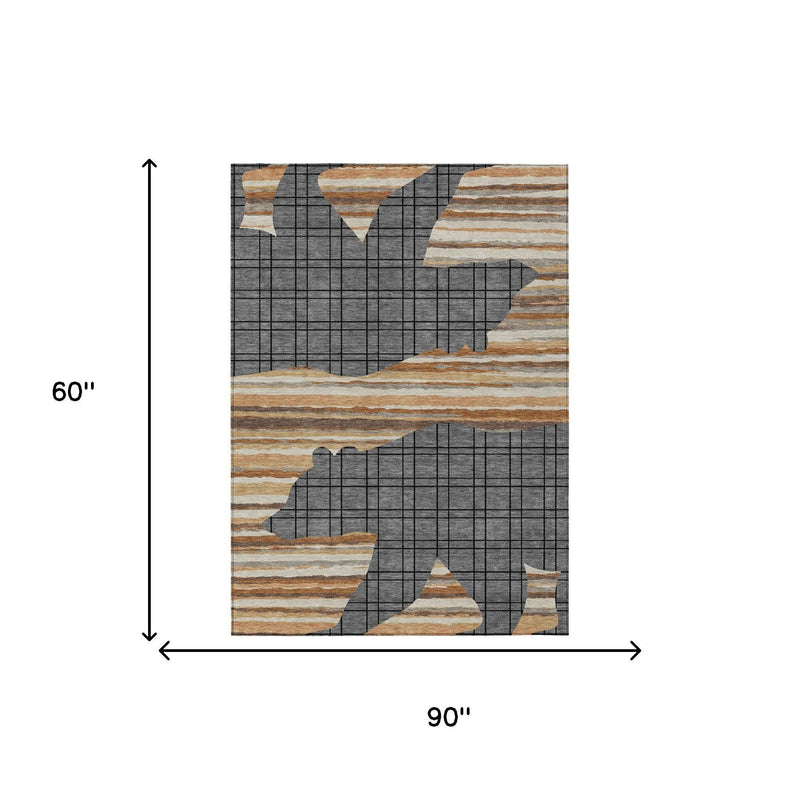 Abstract area rug with gray grid and tan/cream stripe pattern; 60 in by 90 in