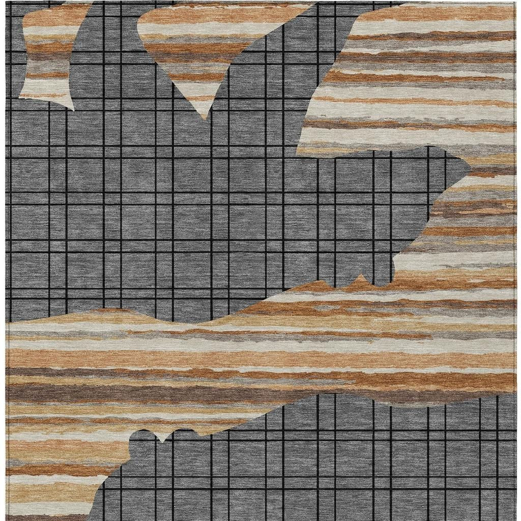 Abstract area rug with gray block-grid and off-white, tan, and brown stripe sections