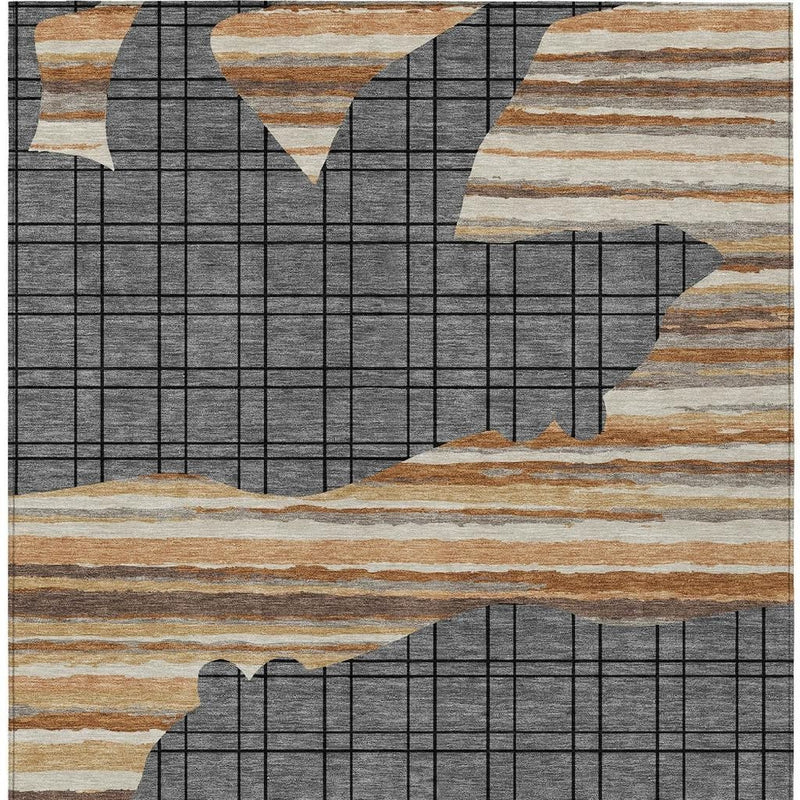 Abstract area rug with gray block-grid and off-white, tan, and brown stripe sections