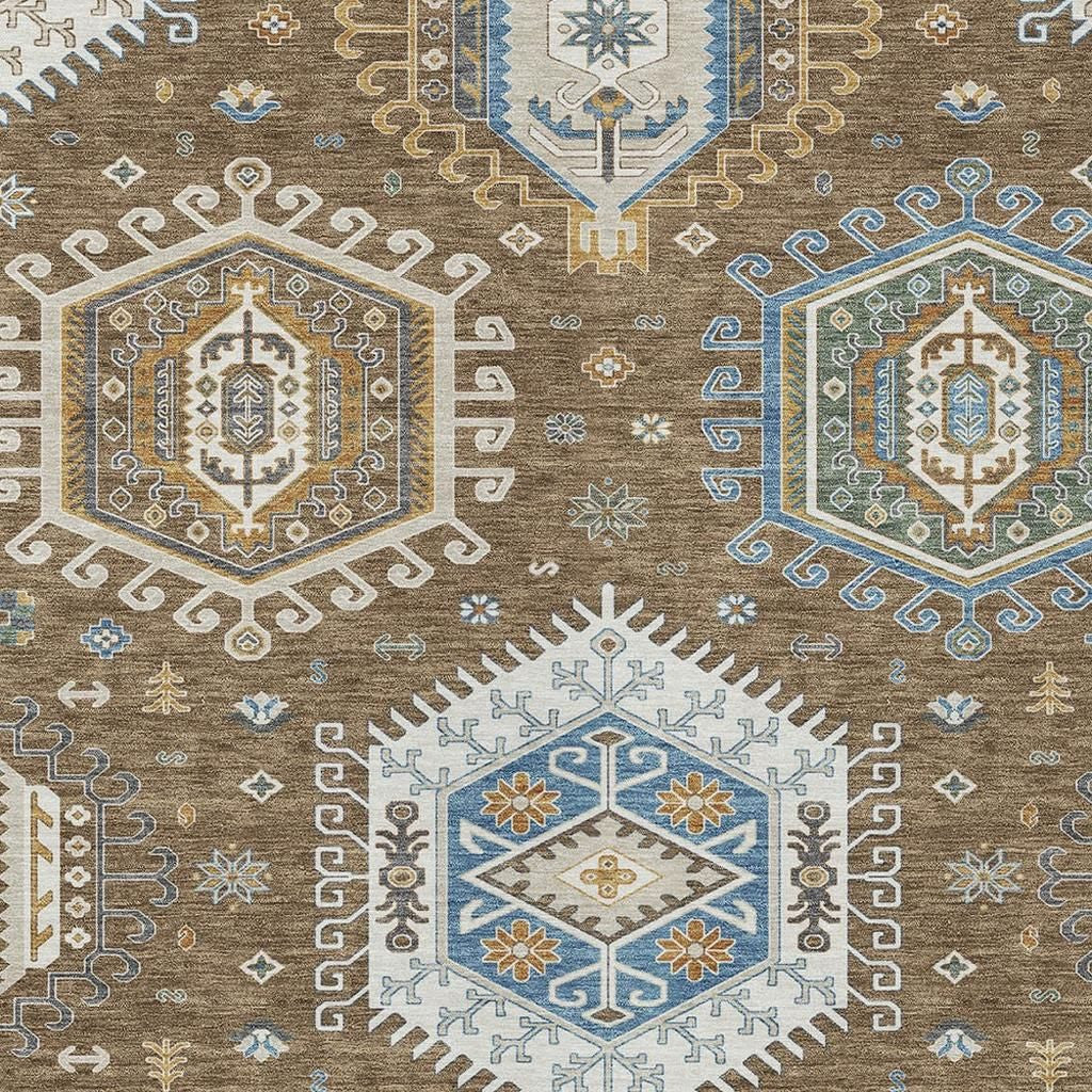 Close-up tribal area rug pattern with blue, tan, and gold medallions and small motifs