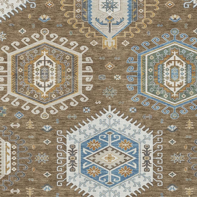 Close-up tribal area rug pattern with blue, tan, and gold medallions and small motifs