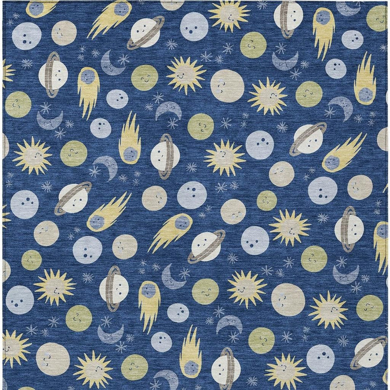 Navy blue area rug with repeating planets, moons, and yellow sunburst motifs; full pattern.