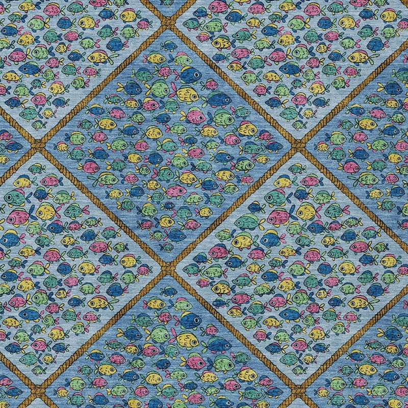 Close-up blue area rug with gold-edged diamond grid and colorful fish motifs