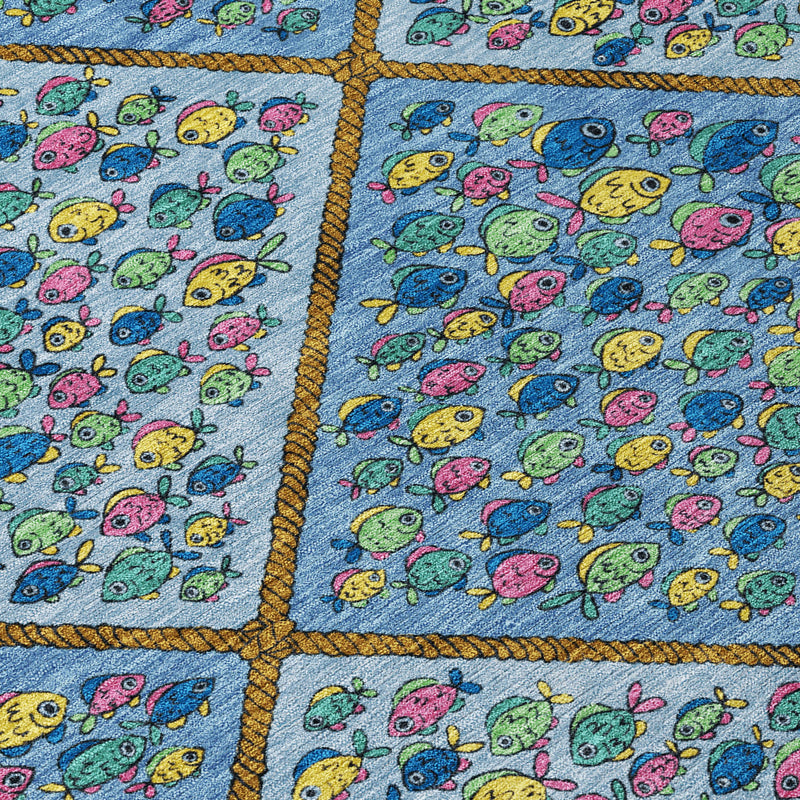 Blue area rug close-up with gold-stitched diamond sections filled with bright fish