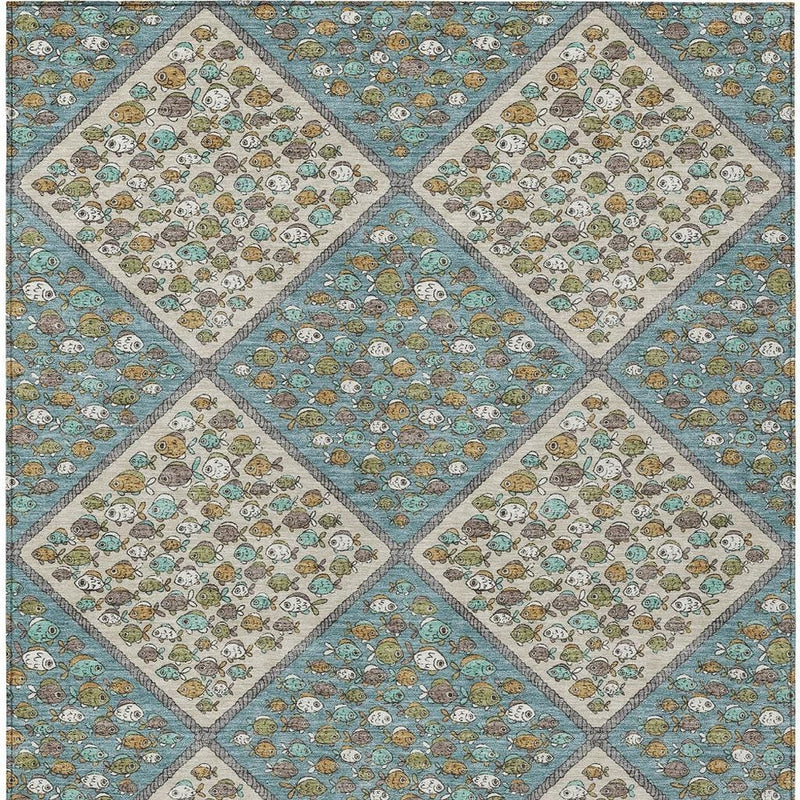 Teal blue and beige washable area rug with repeating diamond blocks and border stitching