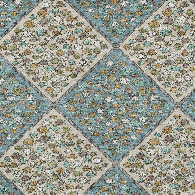 Teal blue and beige area rug close-up showing diamond panels with small illustrated motifs