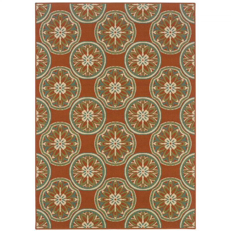 Terracotta outdoor rug with floral medallion pattern, durable polypropylene material, perfect for patios and gardens.
