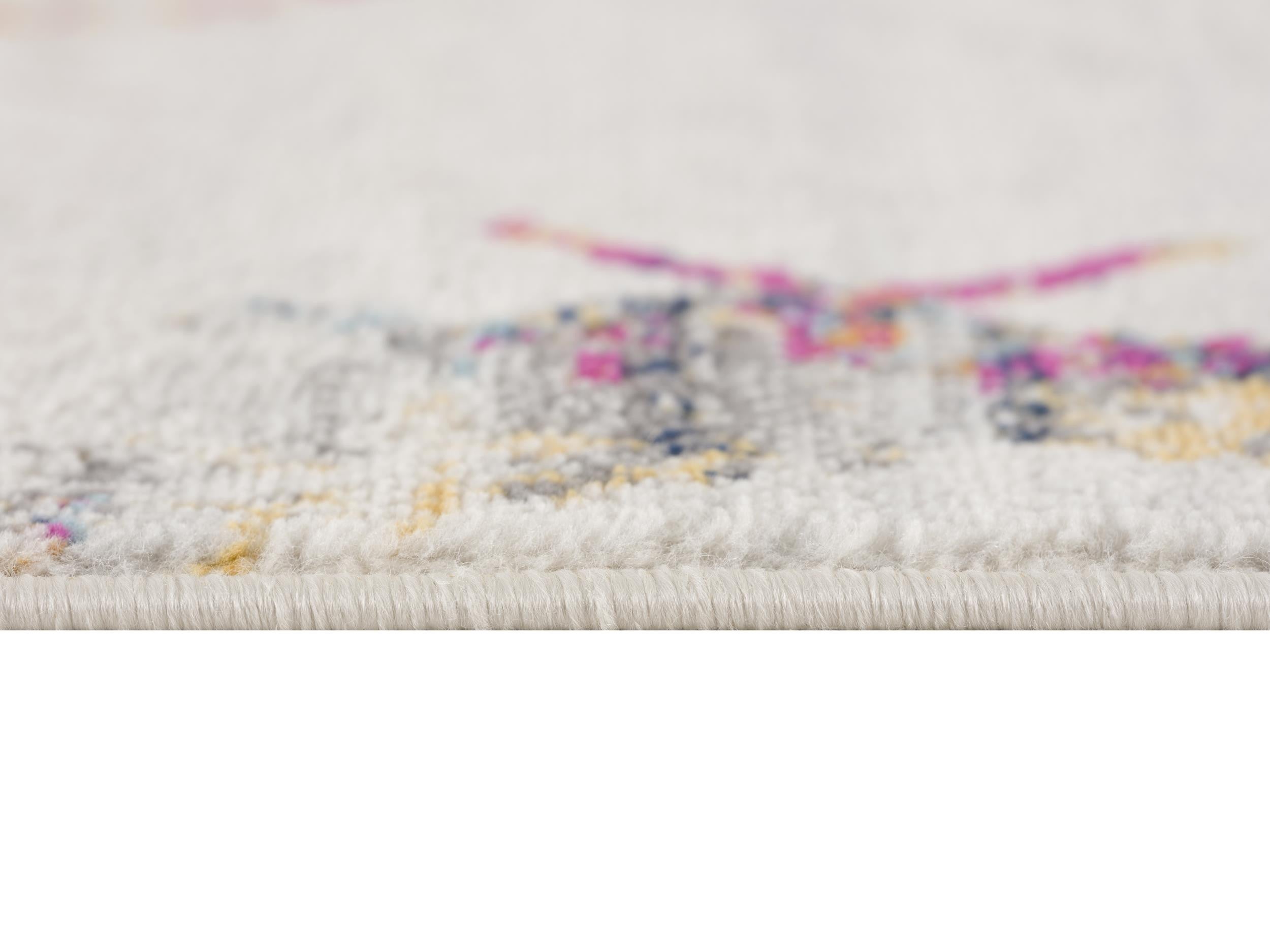 Soft white area rug with vibrant pink and yellow patterns, crafted from plush synthetic fibers.