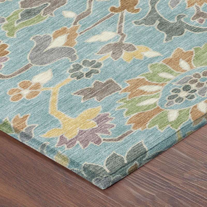 Teal blue floral area rug corner with multicolor vines and flowers, flat-woven