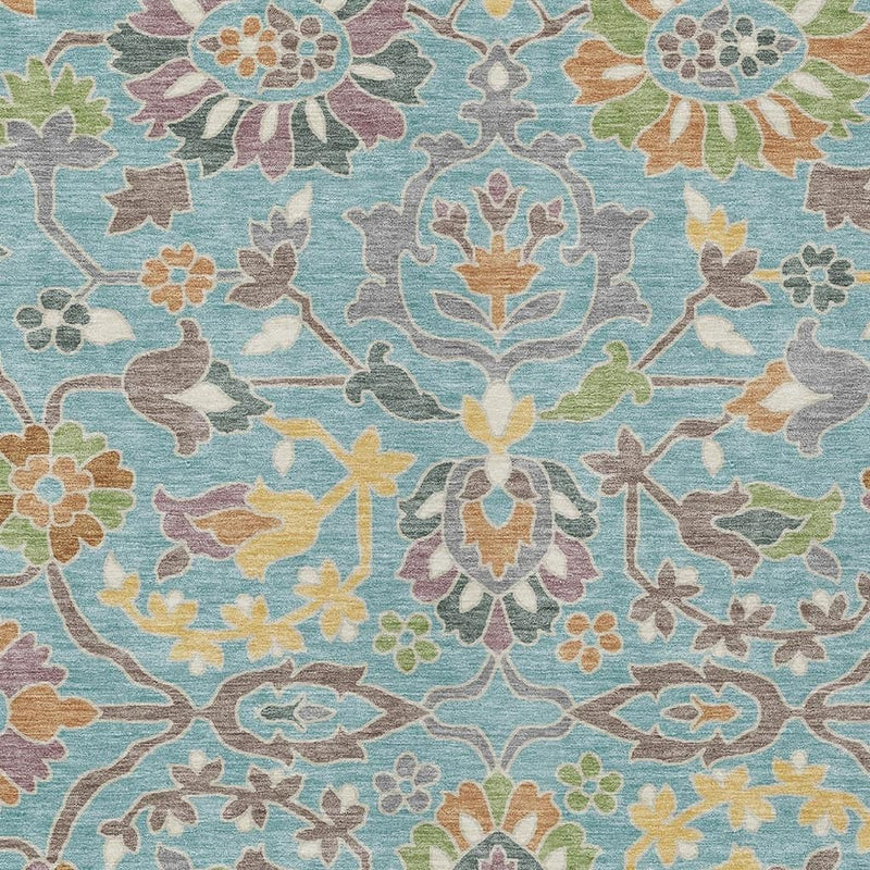 Teal blue floral area rug with symmetrical rosette flowers and scrolling vines