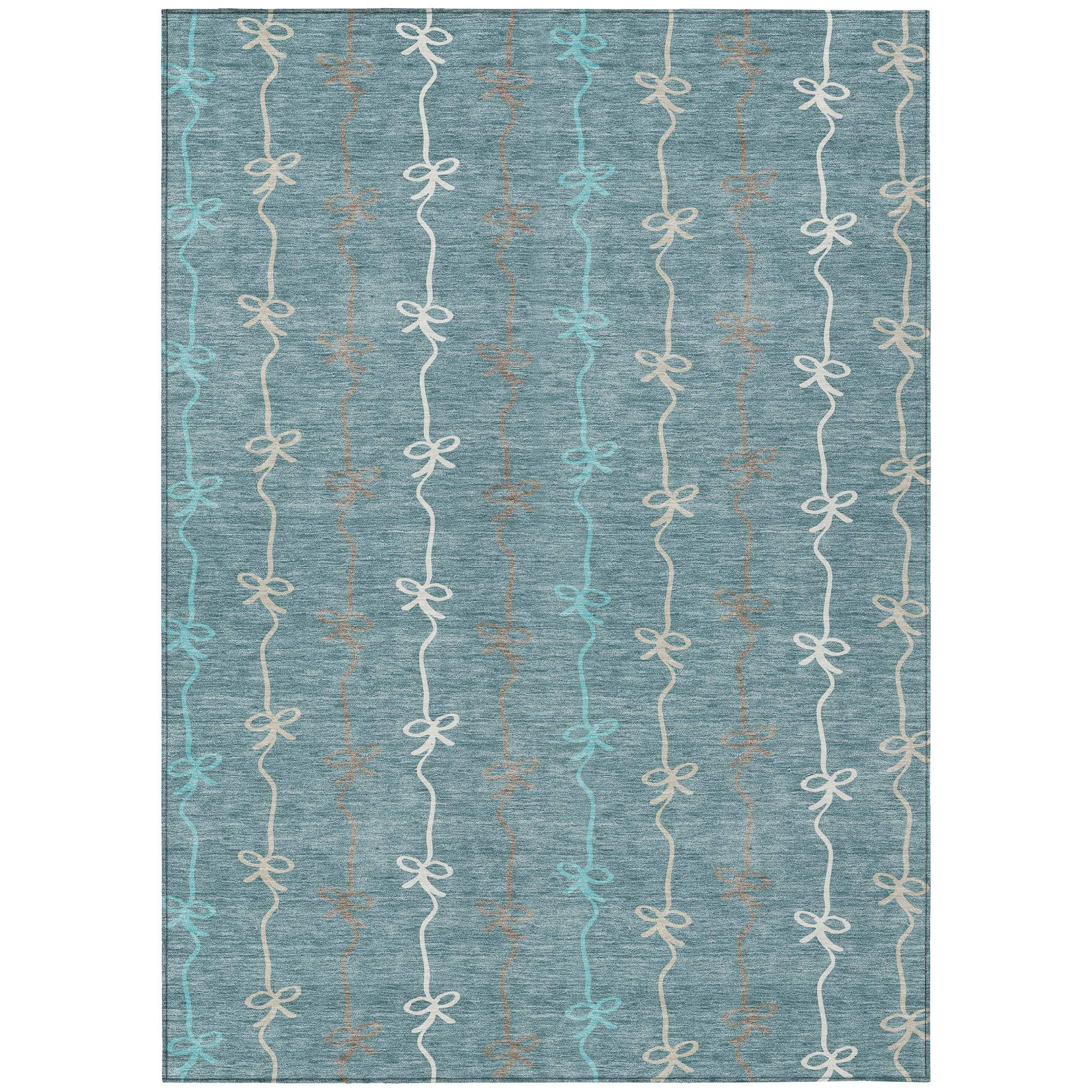 Blue and gray woven rug with delicate bow pattern in white and copper, ideal for modern home decor.