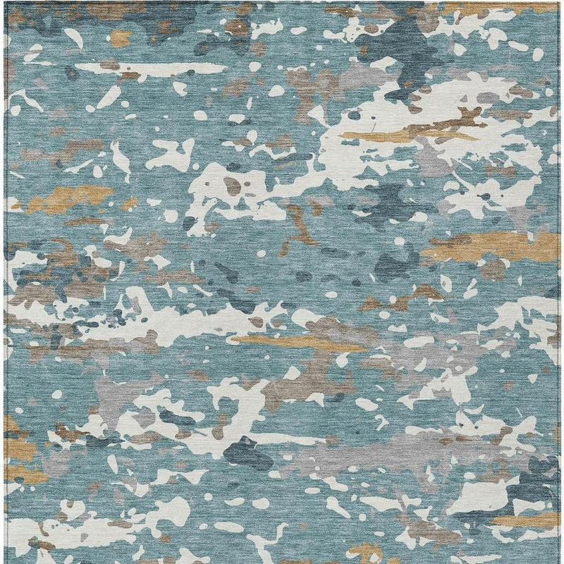 Abstract teal and ivory area rug with scattered camouflage-like shapes