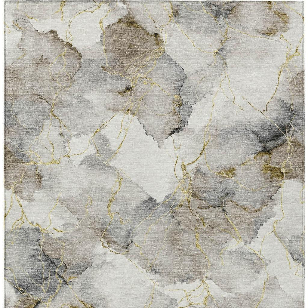 Abstract gray and beige area rug with gold accents in a luxurious, modern design. Perfect for contemporary decor.