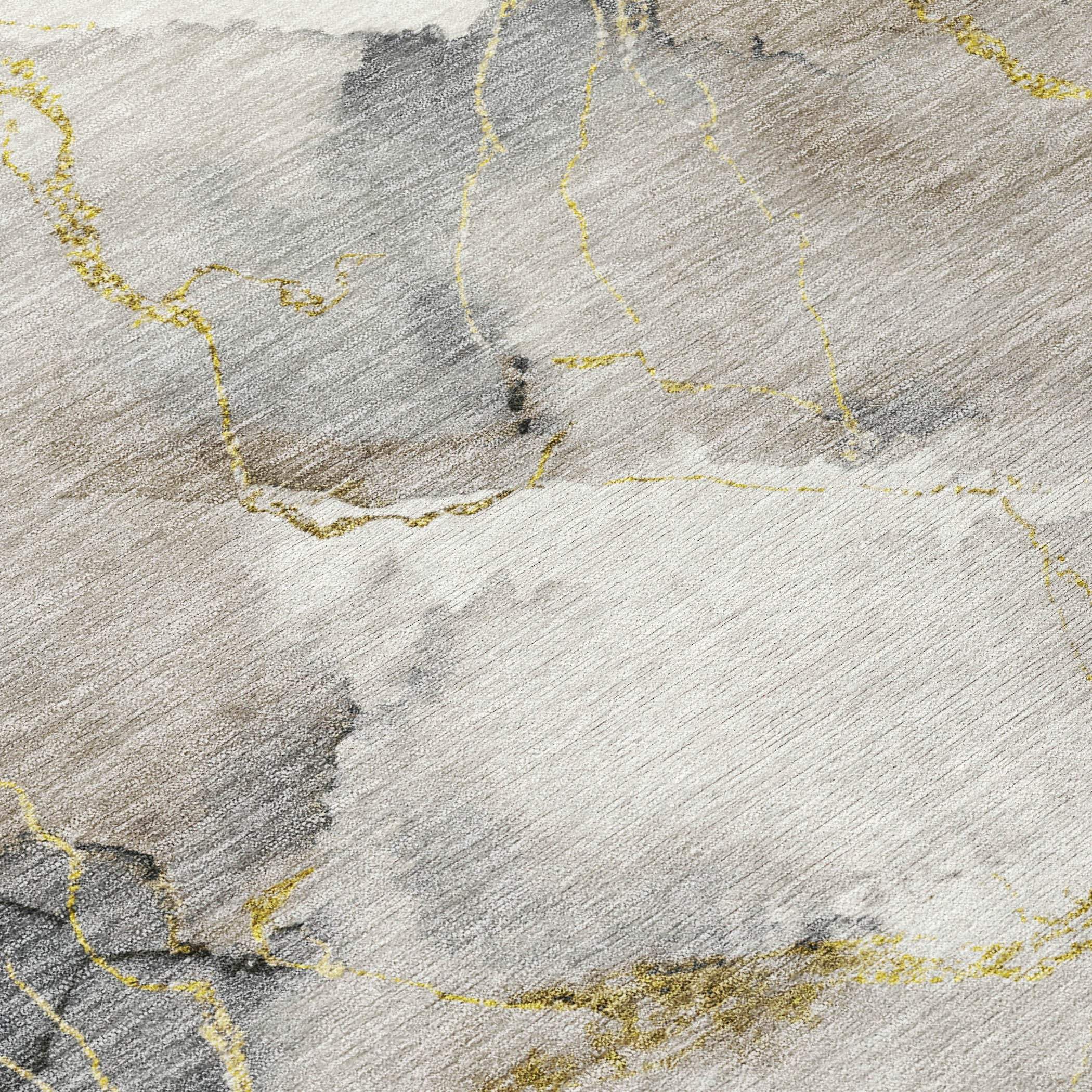 Abstract gray and beige area rug with gold accents, featuring a modern, elegant design suitable for contemporary decor.