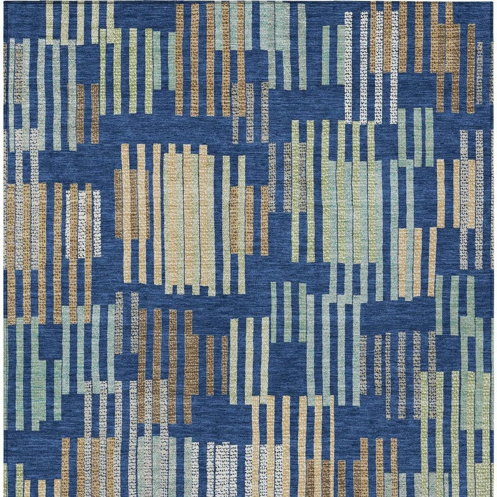 Blue multi-color area rug featuring abstract striped patterns in green, beige, and brown, made from soft, durable fibers.