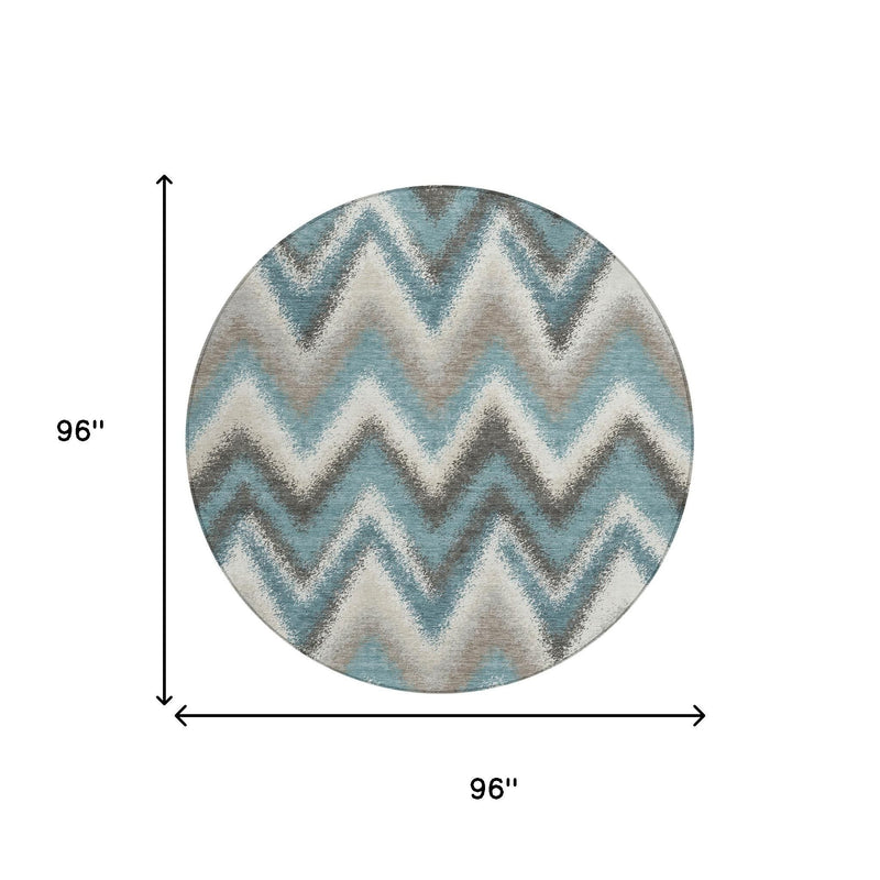 Round area rug with teal and charcoal zigzag pattern, 96 in diameter