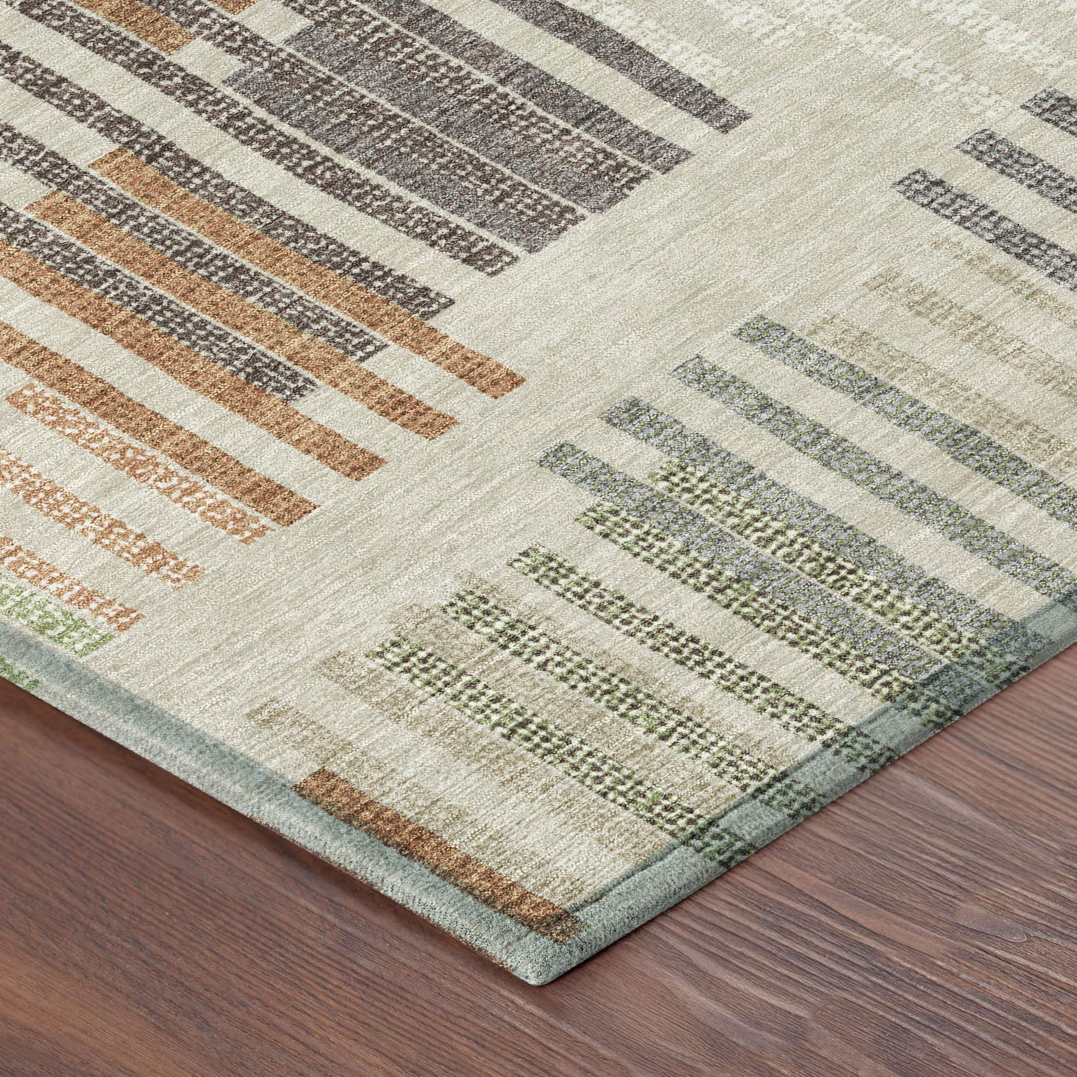 Multicolor geometric area rug in beige, brown, green, and grey, made of soft, durable fibers for modern decor.