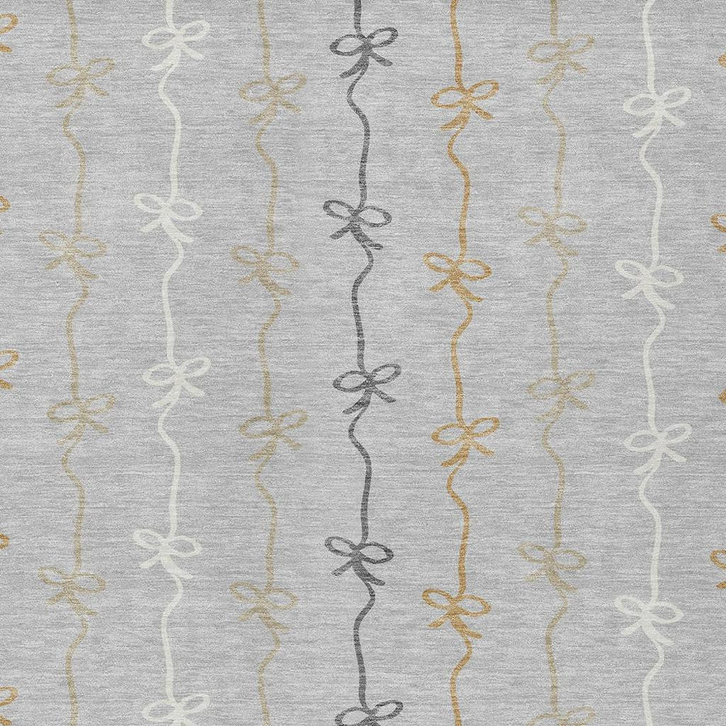 Gray fabric with vertical ribbon bows in gold, silver, and black trends. Perfect for crafts and home decor.