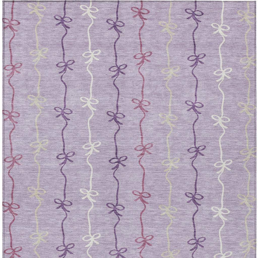 Purple pastel fabric with whimsical bows in lavender, cream, and burgundy. Ideal for crafts and home decor projects.